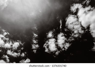 Black  sky background with white clouds, horizontal