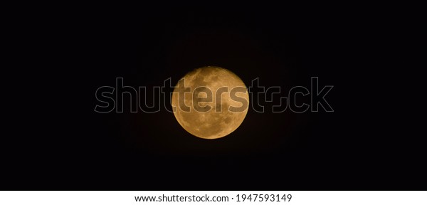 Black sky with night moon, gold 
 color moon, hot color
moon 