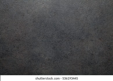 Black slate background or textured stony table