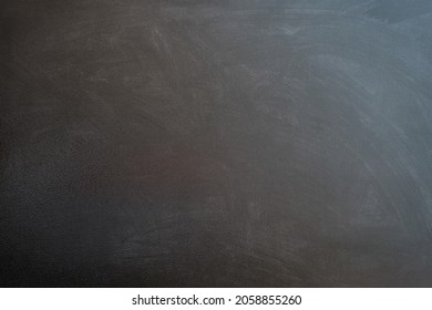 Black slate or stone texture background, horizontal. Blue-black tint on the wall.