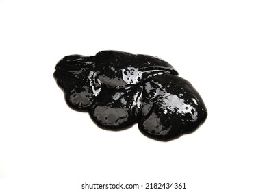 Black Slime Spreads On A White Background