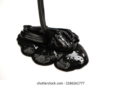 Black Slime Spreads On A White Background