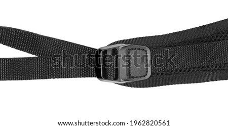 Black sling bag strap isolated on white background, top view