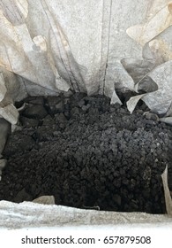 Black Sludge Disposal From Wastewater Treatment In White Plastic Bag