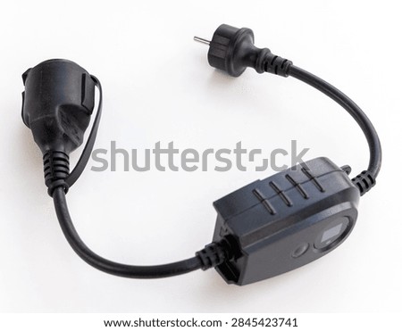 A black smart plug with an inline timer on a white background
