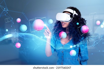Black smiling woman in vr glasses, finger touching data spheres and blocks, colorful lines and digital network. Concept of metaverse