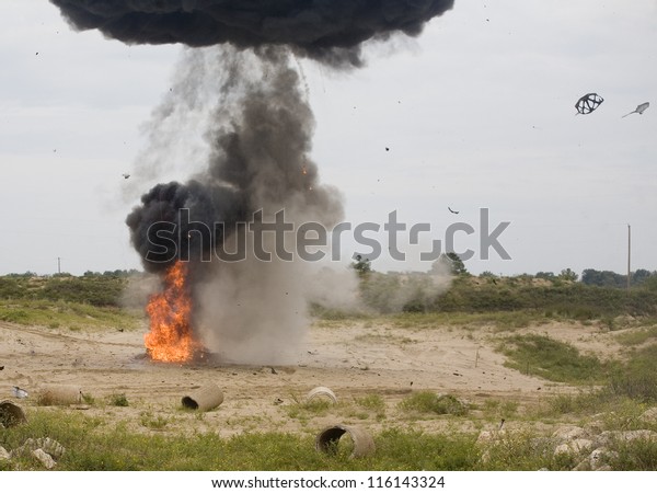Black\
smoke rising above a car that has just\
explosed