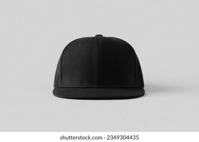 Black snapback cap mockup on a grey background, front view.