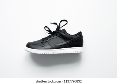 Black sneakers on white soles Images 