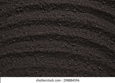 Black soil texture, background 