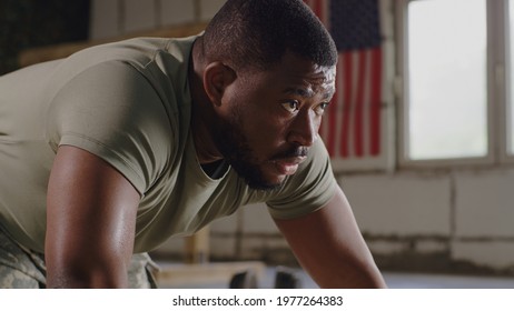 Black soldier doing push ups in gym - Powered by Shutterstock