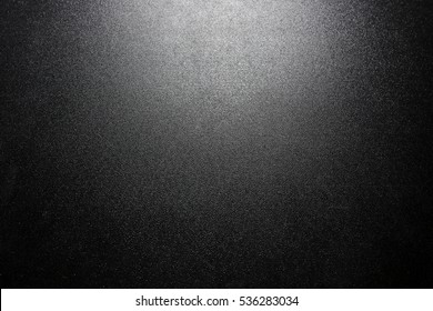 black sparkling background with spotlight