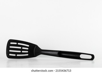 Black spatula for nonstick pan cooking with copy space 