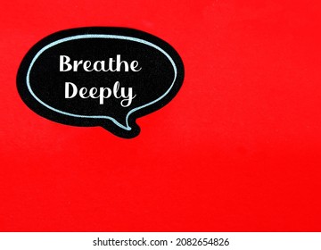 Black Speech Bubble Sticker, Sticking On Red Copy Space Paper Background, With Text Written Breathe Deeply, Self Reminder To Calm Down And Lower Stress In The Body By Inhale And Exhale Deeply 