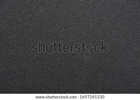Black sponge texture. foam rubber background.