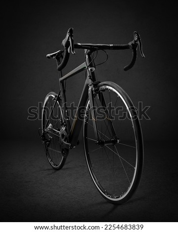 Black sports bike on a black background studio background for advertising and posters