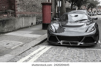 black sports car parked, front view , car repair, used car sales,  Receiving a car on Commission. Global auto industry crisis

