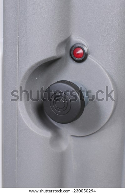 black start button\
with red detector closeup