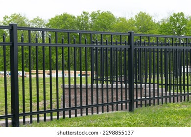 black steel fence of residential house modern style secure green ornament