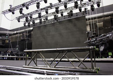 Black Steel Rigging Truss For Lifting. Installation Of Professional Sound, Light, Video And Stage Equipment For A Concert.