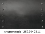 black steel sheet with rivet border, grunge darkness metal plate texture, iron post or beam or metallic sign, close-up with copy space for background