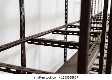 Black Steel Shelves Structures Made From Slotted Angle Steel Bar Drill Holes.