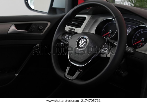Black steering wheel with Volkswagen Golf logo\
of the seventh generation of the German automaker Volkswagen (June\
27, 2022, Ukraine)