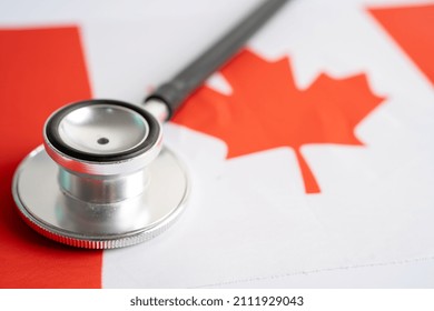 Black Stethoscope On Canada Flag Background, Business And Finance Concept.