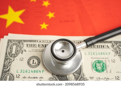 Black Stethoscope On China Flag Background With US Dollar Banknotes, Business And Finance Concept.