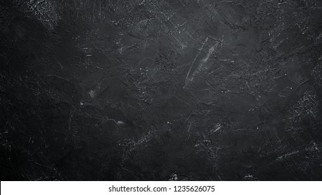 Black stone background. Black surface. Top view. Free space for your text. - Shutterstock ID 1235626075