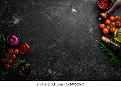 Black stone cooking background. Spices and vegetables. Top view. Free space for your text. - Shutterstock ID 1914852676