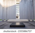 The black stone with inscription at the John F. Kennedy Memorial Placa, in Dallas, Texas, USA.