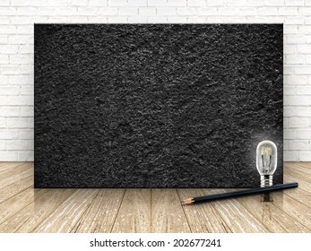 Black stone on the white  brick wall and the wood floor,template for your content
