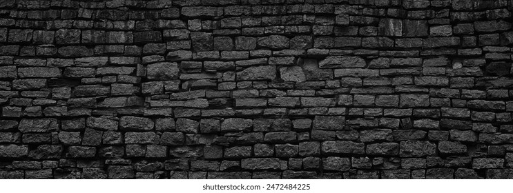 black stone wall an old castle, dark background of slate bricks - Powered by Shutterstock