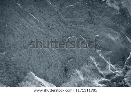 Black stone wall texture background. Gray pattern of rock from nature.