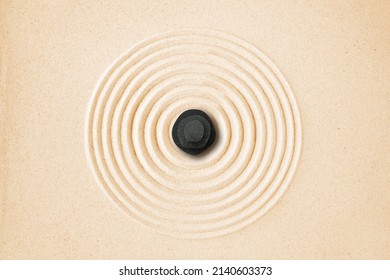 Black Stones Pile In The Sand. Zen Japanese Garden Background Scene. Top View