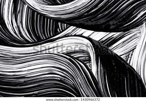 Black strokes and texture of mascara or\
acrylic paint on a white\
background
