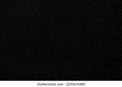 Black structured texture, a sheet of black grainy paper as background