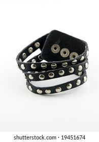 A Black Studded Punk Bracelet On A White Background.