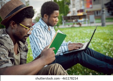 Black students in the park. Beautiful background.