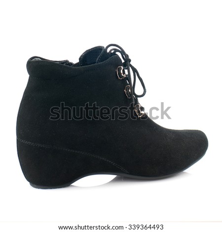 Black suede boot isolated on white background.