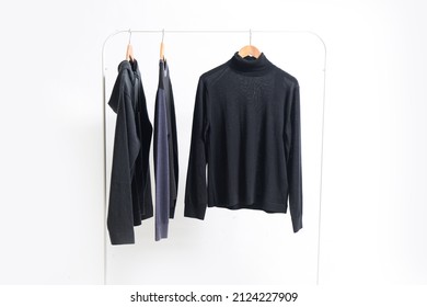 black sweater and hoodie, hoody sweater on hanger