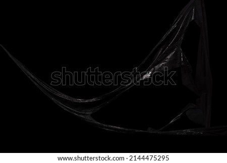 Black symbiote sismucus, sticky slime over dark background