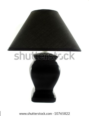 Black table lamp with triangular lamp shade.
