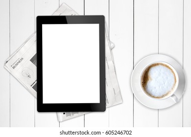 Black tablet with isolated screen and business newspaper on a wooden white table. Mock up. Lorem ipsum text.