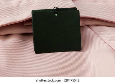 Black Tag On Pink Dress