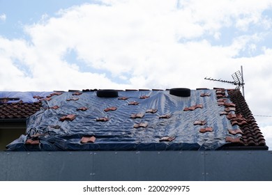 Black Tarp On Roof After Strong Typhoon Wind Damage Hail Thunderstorm 