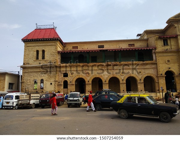 A black taxi is\
leaving Karachi cantt railway station located in old City area.\
Karachi Pakistan - Sep 2019