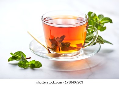 Black Tea In Glass Transparent Mug With Mint Leaves. Soothing Tea, Anti-stress.