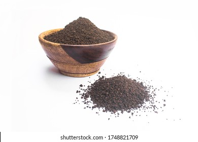 Black Tea Powder Or Dry Dust Tea Powder, Chai Patti Isolated In Wooden Bowl.